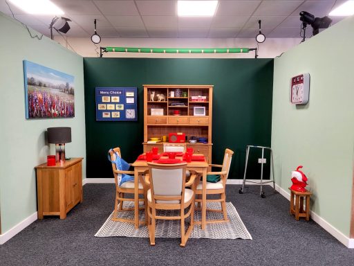 A front on photo of the dining room set in the film studio