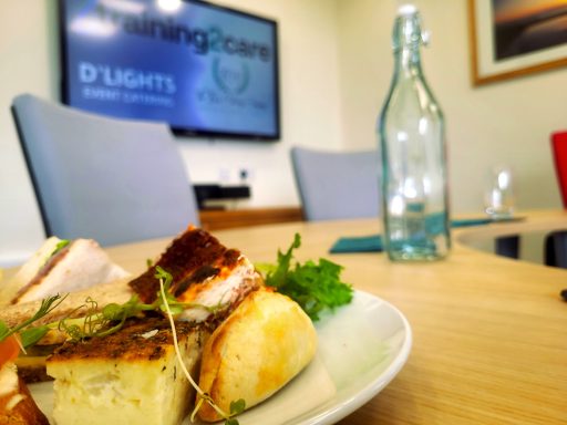 A photo of a plate of a working lunch in a boardroom.