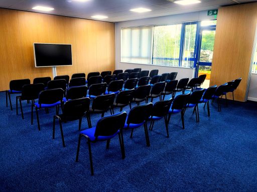 A photo of the theatre layout in a meeting room taken from a side angle