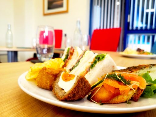 A close up photo of a working lunch on a boardroom table.