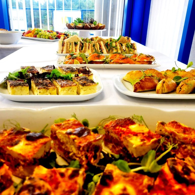 A photo of a buffet table with finger buffet foods and sandwich platter