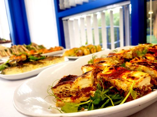 A photo of a quiche platter as part of a buffet