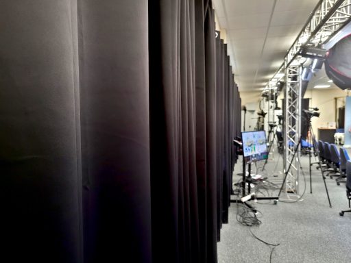 A close up of the blackout curtains in the film studio running the full length of the wall.