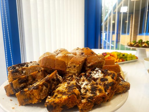  A close up photo of a cake selection raised plate as part of a buffet